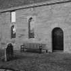 View of windows and doorway on S wall from SE.