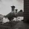 Detail from W of pagoda kiln roofs and boiler-house chimney.