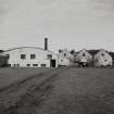 General view from S of S elevation of filling store and maltings and kilns.