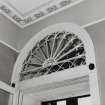 Interior.  Ground floor, outer entrance hall, detail of main doorway showing modillioned transom and inner fanlight