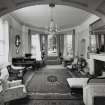 Interior.  Ground floor, living room, view from arched opening from library.