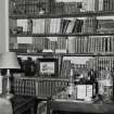 Interior.  Ground floor, library, detail showing adjustable shelves.