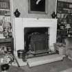 Interior.  Ground floor, library, view of fireplace area.