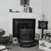 Interior.  Upper floor, apartment in use as office, detail of fireplace area.