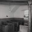 Interior.
Detail of pews and gallery column.