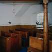 Interior.
Detail of pews and gallery column.