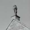 Detail of carved stone figure at apex of south gable of Strathmore aisle