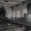 Interior.
Detail of pre 1910 photograph showing church before re-ordering with the pulpit central on the south wall and 19th century pews.