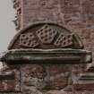 Detail of pediment above niche.