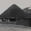 View of thatched horsemill.










