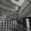 Interior. Main Stair View from SW showing cast iron balustrade and decoration