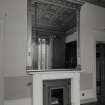 Interior. Ante drawing room Detail of white marble fireplace and overmantle mirror.