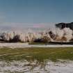 View from South-West during demolition showing dustcloud and falling masonry.