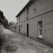 General view of walled garden buildings including bothies from N