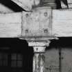 Exchange Street building. Interior.
Detail on second floor, West half of block, showing head of typical flanged column. Columns are 0.12m dia at 3.25m centres, having cast-iron saddles on top for wooden beams. Base of column from floor above is visible.