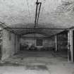 Dock Street building. Interior.
General view of brick vaulting at West end of basement, cast-iron columns 0.18m dia, bottom flanges of the cast-iron beams they support 0.21m wide. The vaulting is 0.38m deep, and columns are at 3.3m centres. Flagstone floor.