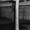 Exchange Street building. Interior.
View of Second floor of East half of block showing central row of flanged cast-iron columns for slotting in partitions, and inserted rows of wooden columns on either side. Centre columns are 0.085m dia, 2.05m high, and are at 2.65m centres.