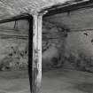 Dock Street building. Interior.
Detail in basement of cast-iron column 1.77m high, 0.18m dia. Bottom flanges of the cast-iron beams they support are 0.21m wide. The vaulting is 0.38m deep and columns are at 3.3m centres. Flagstone floor.