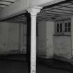 Exchange Street Building. Interior.
Detail of round cast-iron column in West half of block on first floor. The columns have cast-iron saddles for beams, and are 0.13m dia at 3.25m centres.