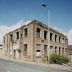 General view from SE showing S and E side of building, emphasising its extremely derelict condition