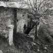 View of remains of mill, including water wheel pit, from WNW