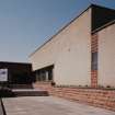 View from SE of main entrance to factory. Note that the sign confirms that the factory was converted from elctronics to furniture manufacture during 1995, Timex having been replaced by the company JTC