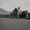 View of South gates and Janitors house from South West