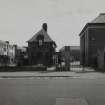 View of North gate and janitors house from West