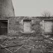 View from South of remaining portion of Hackling House wall. (Two small bricked opening 0.56m wide by 0.40m high).