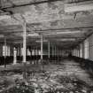 Interior.
General view from North-East of First Floor of Mill Block, showing cast-iron column, flagstone floor, and brick vaulting. The column centres vary from 2.9m to 3.1m.