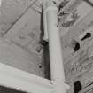 Detail of cast-iron column (0.18m diameter at base) and bracing beam on ground floor of West range of works.