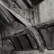 Interior.
Detail of cast iron roof truss on 2nd floor of Mill where truss meets wallhead.