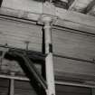 Interior.
Detail of cast iron column, bracket and capital/ beam box on ground floor first flat of Mill.
