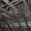 Interior.
Detail of wooden collar-beam roof in jute store.