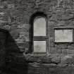 View of capel door filled in with tombstone.