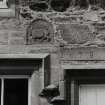 Castlehill.
View of architectural fragment and inscribed lintel in farmhouse wall.