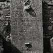 Inscribed grave-slab of 1692 placed within mortuary enclosure in burial- ground.