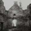 Clunie Castle.
View of interior of tower-house, showing arched doorway.