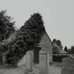 View of building in South corner of graveyard from North West