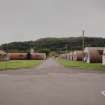 View from N to Main Gate showing officers accommodation (huts 29-38), the medical centre (hut 28) and the Officers Mess (hut 27)