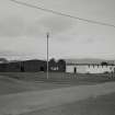 View from SW of main camp store/armoury (hut 19) and central messing building