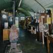 Interior view of workshop / range store (hut 7), showing an original pot bellied stove