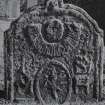 Dunning, St. Serf's Parish Church, Graveyard.
General view of West face of tombstone, 1734. head and sunrays, sock and coulter of plough.
Insc: 'I.S. M.H'.