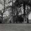 View of Cathedral and ruins of Cathedral from SE through trees