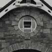 Detail of round window on W face