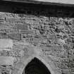 Re-used masonry fragments, built into exterior of S wall of church, near E end