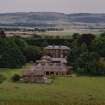 View from N showing house, stables and steading with views over the Tay to Fife.