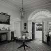 Interior.View of entrance hall from NW showing fireplace and entrance door