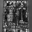 Interior. Detail of chancel stained glass window depicting SS Euan and Bride " That in the name of Jesus every knee shall bow"