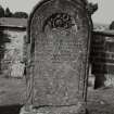 General view of grave 152, commemorating Charles Stewart, 1878. Arched stone with design of a rose bough.